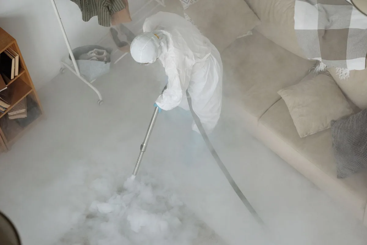 Biohazard cleanup technician in protective equipment, Wolf Trap, VA